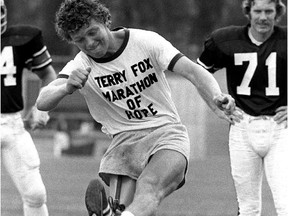 Terry Fox is seen in this July 1, 1980 file photo making the opening kick-off of an Ottawa Rough Riders game.