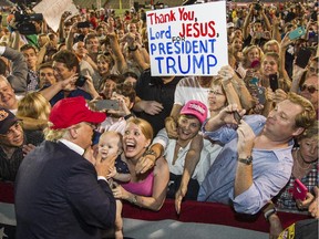 Republican presidential candidate Donald Trump greets supporters after his rally at Ladd-Peebles Stadium on August 21, 2015 in Mobile, Alabama.