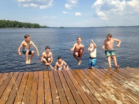 Reader Anne Lefebvre writes to suggest adults should look back fondly on the lazy, hazy days of summers past, when a swimsuit was the standard uniform. Appropriately attired, then, were these six boys who beat the heat on Tuesday by leaping into the cool water of Calabogie Lake at Calabogie Peaks Resort. Flying off the dock are Tyler Lefebvre, left, Malcolm McKenna, Alex Wroe, Zach Wroe, Carson Moran and Carson Lefebvre.