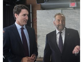 Party leaders  Justin Trudeau, Liberal Party, and Thomas Mulcair, NDP, chat prior to the first leaders debate Thursday, August 6, 2015 in Toronto.