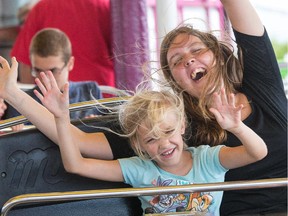 Elyane Brennan, 6, with Byanka Petrin, 16, on the Musik Express at the Capital Fair at the Rideau Carleton Raceway, which begins Friday but Thursday was the annual Ottawa Hydro Special Needs Day which allows more than 1,200 children and adults with physical and/or developmental disabilities from across Ottawa get their own private day at the fair.