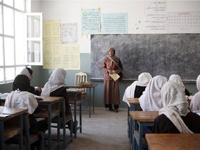 A woman teaches in a governmental girl school in the Eraq valley, Shibar district, in 2009.