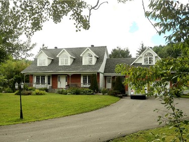 The 21-year-old farmhouse-style home is built on an acre of what used to be a hay field near Gatineau Park. With the addition, it's now about 3,200 square feet.