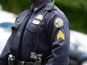 Members of the Chattanooga Police Department arrive at the funeral of Marine Staff Sgt. David Allen Wyatt on July 24, 2014 in Chattanooga, Tennessee. Wyatt was among those who died during the attack on July 16th when Mohammad Youssuf Abdulazeez opened fire at two military locations killing four U.S. Marines.