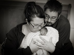 Genevieve Filiatrault and Jason Mougeot hold their baby, Jacob. The photo was taken by Veronique Lalonde, a volunteer photographer with Now I Lay Me Down To Sleep, an organization that offers portraits of largely perinatal infants who have died.
