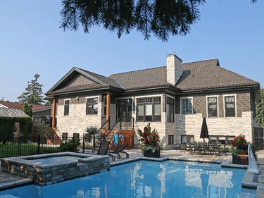 The Staples wanted to retain their property’s spacious 1960s backyard, the kind of sprawling playground once common in subdivisions. That meant designing the new home with the existing pool and hot tub as well as the adjoining green space in mind. Result: extras like a bathroom and the washer and dryer by the back door, perfect for dripping wet young swimmers.