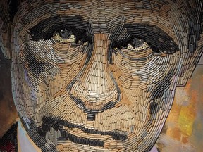 This photo taken on Wednesday, July 22, 2015, shows a portrait of Russian President Vladimir Putin, made by Ukrainian artist Dasha Marchenko out of cartridge cases.