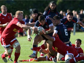 An American ball carrier breaks through against Canada at Twin Elm Rugby Park on Saturday, Aug. 22, 2015.
