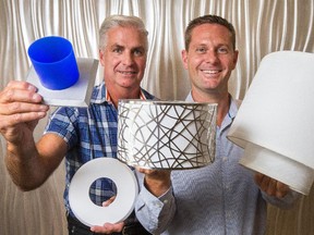 Inventor Kory Keogan, right, and his business partner Mike Fleming have partnered with a Canadian big-box store to sell their EzClipse products —  magnetic covers for recessed lights.