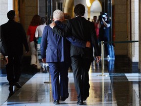 Liberal Leader Justin Trudeau, right, walks with Bob Rae following a press conference on Parliament Hill in Ottawa on Wednesday, June 19, 2013, where Rae announced his resignation.