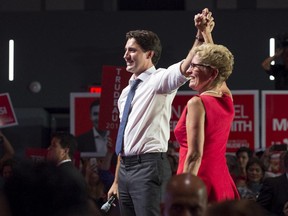 Liberal Leader Justin Trudeau, left, campaigns with Ontario Premier Kathleen Wynne during a stop in Toronto on Monday, August 17, 2015.