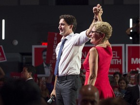 Liberal Leader Justin Trudeau campaigns with Ontario Premier Kathleen Wynne during a stop in Toronto on Monday, Aug. 17, 2015.