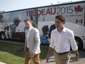 Liberal Leader Justin Trudeau, right, is accompanied by Ajax Liberal candidate Mark Holland as he makes a campaign stop in Ajax, Ont., on August 17, 2015.