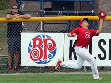Lethbridge (Alberta) Red Giants RF #27 Ty Wevers makes a running catch on a ball hit by High Park (Toronto) Braves' #34 Taeg Gollert.