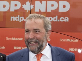 NDP Leader Tom Mulcair smiles while campaigning  in Stratford, Ont., on Wednesday, August 26, 2015.