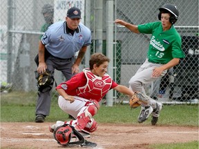 East Nepean's Ben Adams is called out at home plate as he attempts to evade the tag of Lethbridge catcher Teigen Parenteau on Monday, Aug. 10, 2015. The Eagles won 5-2 to improve to 4-0. Adams struck out 13 batters in five innings while Tristan Godmaire homered in the win.