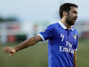 New York Cosmos' Raúl González Blanco (7) talks to the referee.