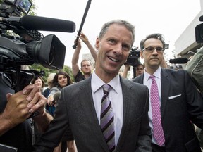Nigel Wright, former chief of staff to Prime Minister Stephen Harper, arrives with his lawyer Peter Mantas (right) to testify at the criminal trial of embattled Sen. Mike Duffy in Ottawa Wednesday, August 12, 2015.