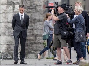 Nigel Wright, former chief of staff to Prime Minister Stephen Harper, arrives at the courthouse in Ottawa for his third day of testimony at the trial of former Conservative senator Mike Duffy on Friday, Aug. 14, 2015. Duffy is facing 31 counts of breach of trust, fraud and bribery.