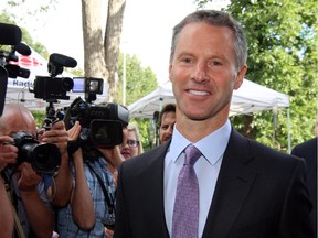 Nigel Wright, former chief of staff to Prime Minister Stephen Harper, arrives at the courthouse in Ottawa on Thursday, Aug. 13, 2015 for his second day of testimony at the criminal trial of embattled Sen. Mike Duffy.