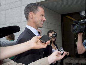 Nigel Wright, former chief of staff to Prime Minister Stephen Harper, arrives at the courthouse in Ottawa on Thursday, Aug. 13, 2015 for his second day of testimony at the criminal trial of embattled Sen. Mike Duffy.