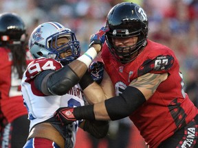Offensive lineman Colin Kelly of the Ottawa Redblacks blocks defensive lineman Michael Sam of the Montreal Alouettes. Sam made his CFL debut on Friday, Aug. 7, 2015 at TD Place in Ottawa.