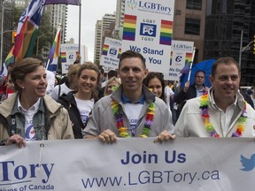 Ontario PC Leader Patrick Brown (centre) walks the route during Toronto's Pride Parade on Sunday June 28, 2015.