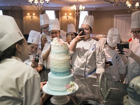Students in Le Cordon Bleu's professional pastry program admire chef Julie Vachon's finished wedding cake.