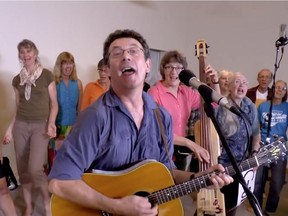 Ottawa folksinger Tony Turner wrote and performed the song Harperman with help from Ann Downey on bass and the Crowd of Well Wishers choir.