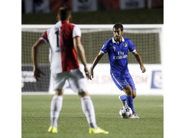 Ottawa Fury's Oliver Minatel (11) keeps an eye on Raúl González Blanco (7).