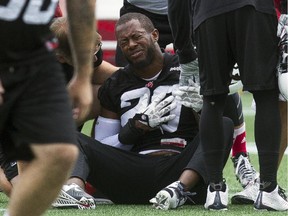 Ottawa Redblacks David Hinds gestures in pain during practice at TD Place  Tuesday.