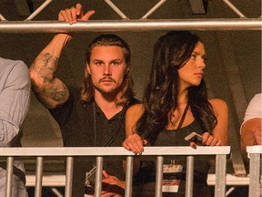 Ottawa Senators captain Erik Karlsson and his girlfriend Melinda Currey wait for the Kanye West show to begin as day 3 of the RBC Ottawa Bluesfest continues at the Canadian War Museum.