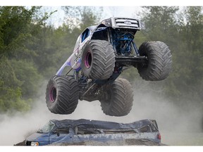 The Overkill Evolution monster truck jumps over the crushed cars at the Capital Fair held at Rideau Carleton Raceway on Sautrday, Aug. 22, 2015.
