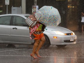 Pedestrians in downtown Ottawa found themselves jumping over puddles, hiding under umbrellas and scurrying to shelter out of the torrential thunderstorm.