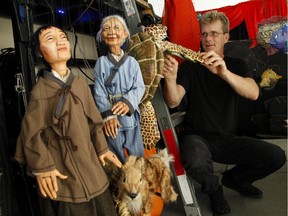 Puppeteer Peter Schaefer from Tanglewood Marionettes preps backstage before a show at the Puppets Up! International Puppet Festival in Almonte on Saturday, Aug. 8, 2015.