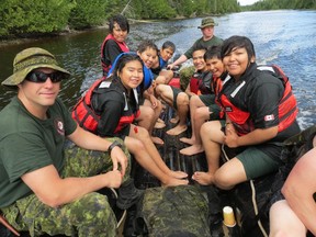 Junior Canadian Rangers from First Nations across the North, including the James Bay area, get ready to jump off a moving assault boat while attending a recent camp near Geraldton.