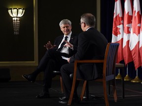 Conservative Leader Stephen Harper takes part in a question and answer session with Dan Kelly of the Canadian Federation of Independent Business (CFIB) as he makes a campaign stop in London, Ont., on Wednesday.