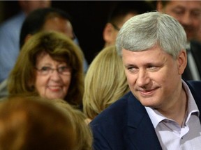 Senator Marjory LeBreton, left, looks on as Conservative Leader Stephen Harper makes a campaign stop in Ottawa on Sunday, August 16, 2015.