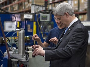 Conservative Leader Stephen Harper tours an industrial parts plant  on August 3 in Laval, Que.
