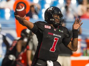 Ottawa RedBlacks' quarterback Henry Burris throws the ball against the Toronto Argonauts during the first half of CFL football action in Toronto, Sunday, August 23, 2015.