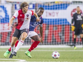 The Ottawa Fury's Tom Heinemann looks for a teammate to move the ball to during NASL action against the Indy Eleven in Indianapolis on Saturday, Aug. 8, 2015.