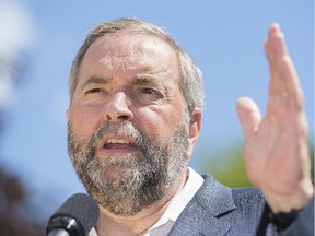 NDP Leader Thomas Mulcair speaks to supporters during a federal election campaign stop in Saint Jerome, Que., on Saturday, August 22, 2015.