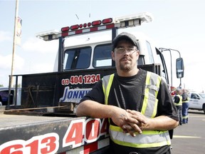 Tow truck driver Manny Medeiros and other tow truck drivers gather at the Canadian Tire Centre in support of a colleague who was struck on the 417 only days earlier.
