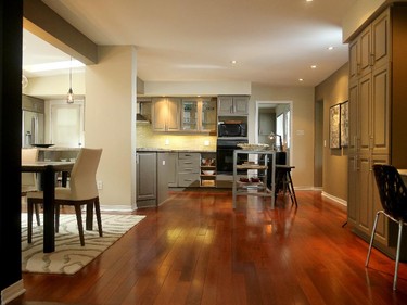 An open area between the kitchen table and a desk nook is perfect for impromptu dances when company's over.