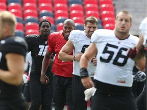 #10 Malik Jackson (L), Henry Burris (2nd from L), #81 Patrick Lavoie (2nd from R) and  Alex Mateas (56) of the Ottawa Redblacks during a recent practice.