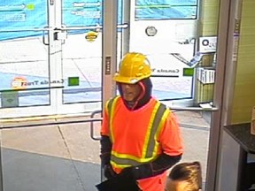 Police website on Friday, May 15, 2015 shows an image from security video of a man wanted for multiple bank robberies. The Canadian Bankers Association is offering a $100,00 reward for the positive identification of one of Canada's most notorious bank robbers, nicknamed the Vaulter.