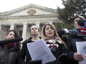 In this 2014 file photo, the Independent Initiative Against Rape Culture on campus at the University of Ottawa holds a press conference in front of the Tabaret Building at the University of Ottawa. (Pat McGrath/OTTAWA CITIZEN)