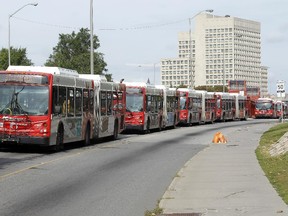 A long line of OC Transpo buses are backed up along the Nicholas Ave transit way Tuesday September 08, 2015.