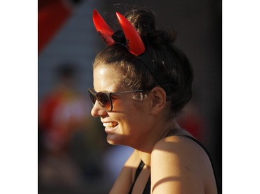 A woman sells devil horns before the AC/DC concert.
