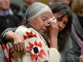 Residential school survivor Lorna Standingready is comforted by a fellow survivor during the closing ceremony of the Indian Residential Schools Truth and Reconciliation Commission, at Rideau Hall in Ottawa on Wednesday, June 3, 2015.